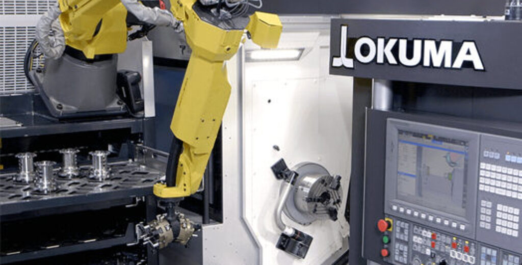 Industrial robot operating an Okuma CNC machine